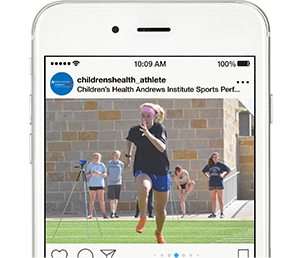 Mobile phone mock up with female high school athlete sprinting