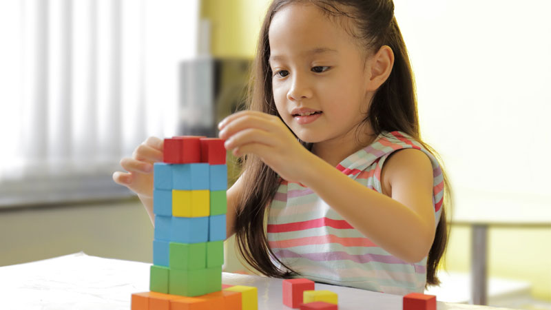 girl playing with blocks