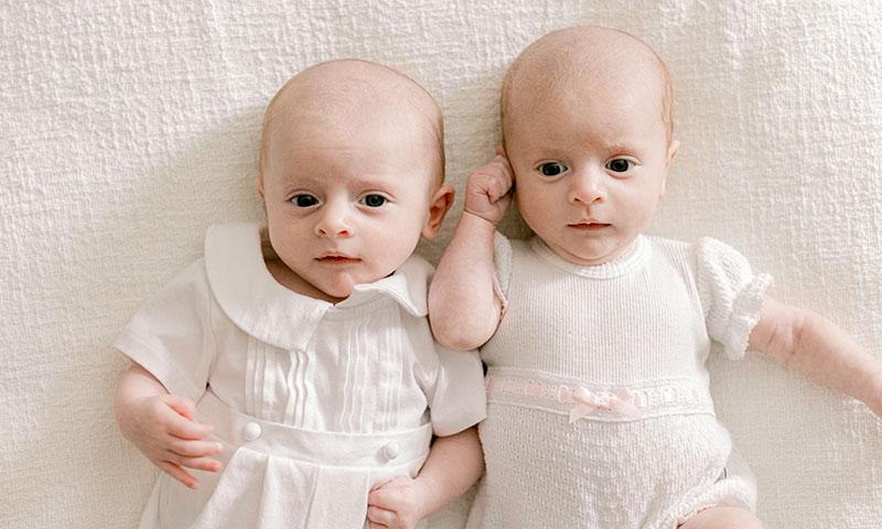 Twins looking directly at the camera.